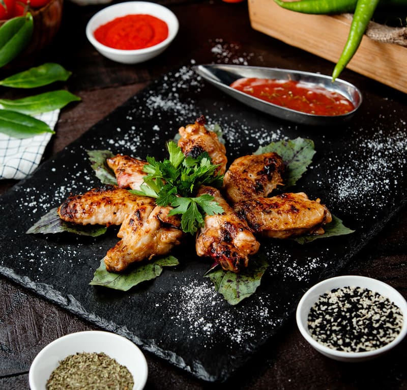 Grilled chicken with herbs and a tomato dip